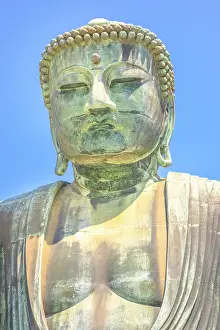 Vertical shot of Big Buddha or Daibutsu on blue sky
