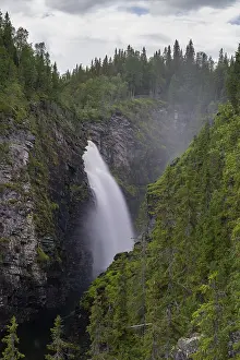 A vertical view of the Hallingsafallet waterfall in northern Sweden