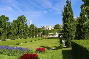 Vienna Volksgarten with a view of the famous Sisi Monument with the Town Hall Tower