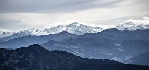 View of the Alpine foothills and the main Alpine ridge with snow-covered peaks
