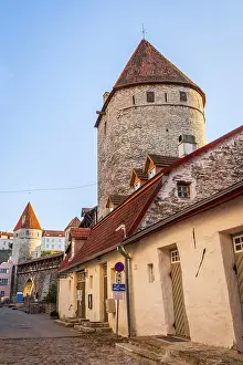 View on ancient street with medieval wall of Tallinn