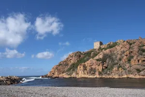 View from the beach of the red rocks and the Genoese Tower (Tour Genoise de Porto)