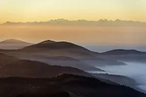 View from Belchen heading south of Wiesental and the Swiss Alps