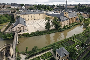 View from the Bockfelsen cliffs towards the Grund district with Neumuenster Abbey and gardens on the Alzette River