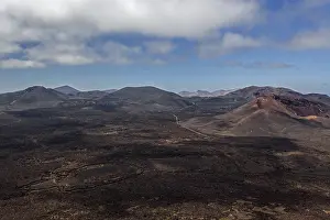 View from the Caldera Blanca volcano on the volcanic landscape of the Timanfaya National Park