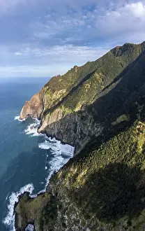 View of cliffs and mountains overgrown with forest