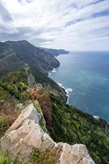 View of cliffs and mountains overgrown with forest