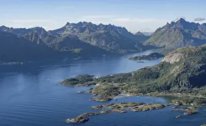 View of coast in Raftsund fjord and mountains in the evening light