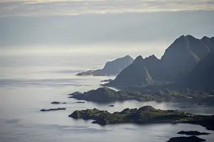 View of the coast in Ulvagsundet fjord and mountains in the evening light
