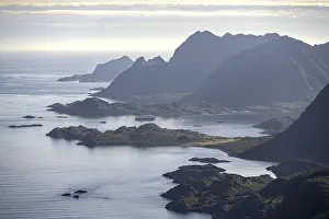 View of the coast in Ulvagsundet fjord and mountains in the evening light