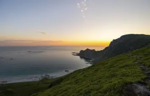 View of coastal landscape at sunset
