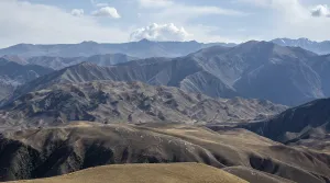 View over eroded mountainous landscape with brown dry hills