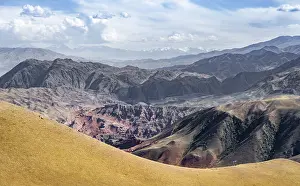 View over eroded mountainous landscape with brown hills