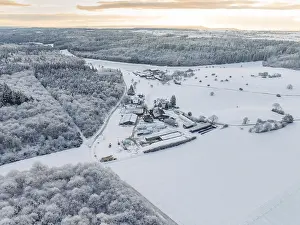 View of an extensive snow-covered landscape with forest