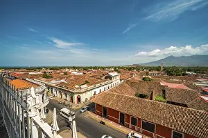 Top view of the facade of some colorful colonial buildings in the city of Granada