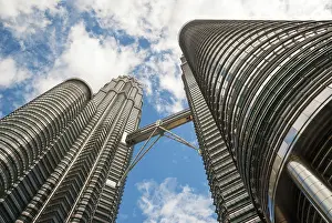View on famous high-rise Petronas twin tower with bridge from below