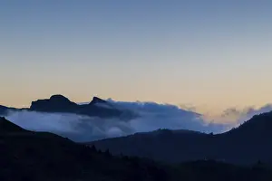 View from Furkajoch a mountain range above a sea of fog