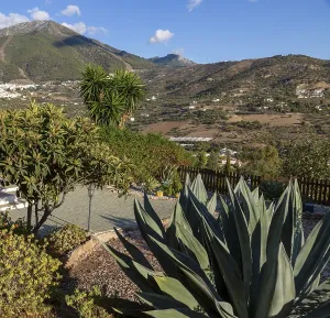 View over garden small hotel view to Alcaucin vitally and Maroma mountain upper left