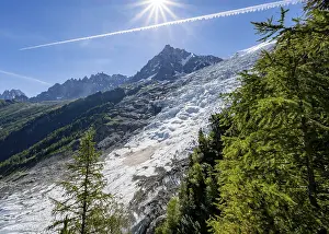 View of glacier Glacier des Bossons with sun star