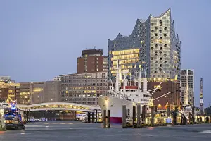 View of Hamburg's harbour with the Elbphilharmonie and Cap San Diego at the blue hour at the Landungsbrucken