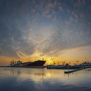 Category Historic EN Prints: View of a harbour basin and a freighter at sunset