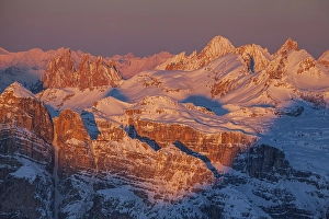 View of high plateau and mountains in the snow at sunset