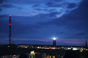 View of the highlands of the island of Heligoland at night with red-lit radio tower