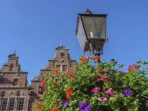 View of historic buildings and an old lantern against a clear blue sky