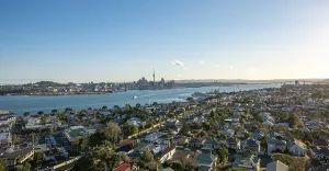 View over the houses of Devonport to the skyline of Auckland with Sky Tower