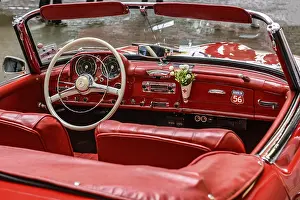 View into interior of convertible classic car Mercedes SL 190 with red leather