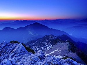 View from the Kampenwand to the Chiemgau and Berchtesgaden Alps at dawn