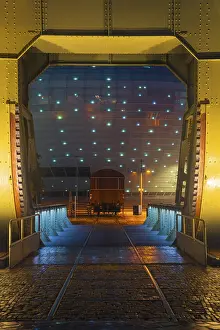 Category Historic EN Prints: View of the Klimahaus in Bremerhaven at night through a historic bascule bridge