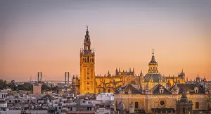 View of La Giralda and Iglesia del Salvador at sunset