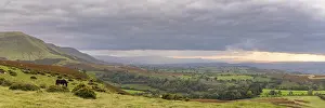 View over the landscape of the Brecon Beacons National Park on a cloudy day