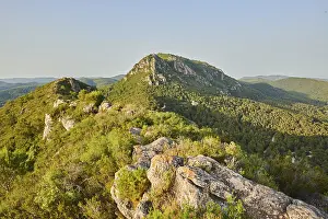 View onto Mount "La Talaia del Montmell" with Castell de Montmell at evening