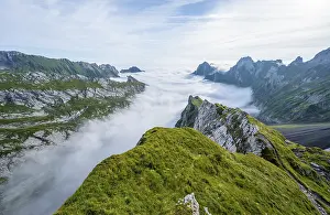 View of mountain peaks above the sea of clouds