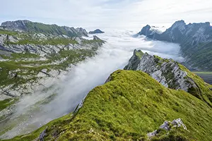 View of mountain peaks above the sea of clouds