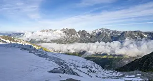 View of mountain peaks and the valley of Chamonix with high fog