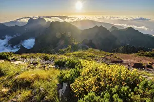 View of mountains over clouds from Pico Ruivo on sunset