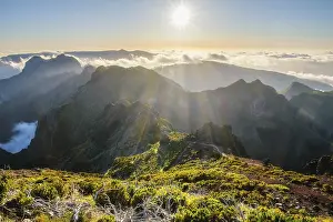 View of mountains over clouds from Pico Ruivo on sunset