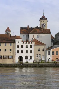 View from Oberer Woehrd district across the Danube River looking towards the historic district and Rathausturm tower