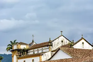 Back view of old colonial style church and roofs in the historic center of Paraty in overcast day