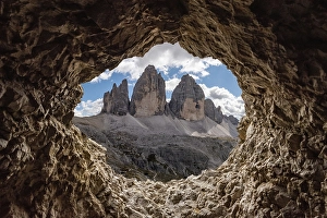 Category Mountain Landscapes Prints: View out of an old tunnel window towards the iconic Three Peaks mountain in the Dolomite Alps