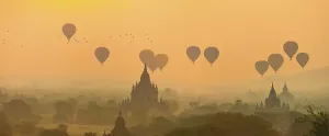View of pagodas with hot air balloons