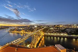 View of Porto with the Dom Luis I bridge and the Douro river after sunset