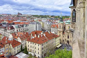 View over Prague city red roofs and Castle