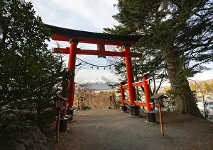 View through red torii of Mount Fuji volcano