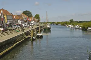 View of river, boats and quay in historic town