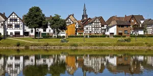 View over the river Weser to the old town centre of Bodenwerder with the church tower of St