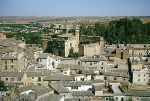 View over the roofs of the historic buildings to the city gate Puerta Nueva de Bisagra, Toledo, Castilla La Mancha, Spain, Europe